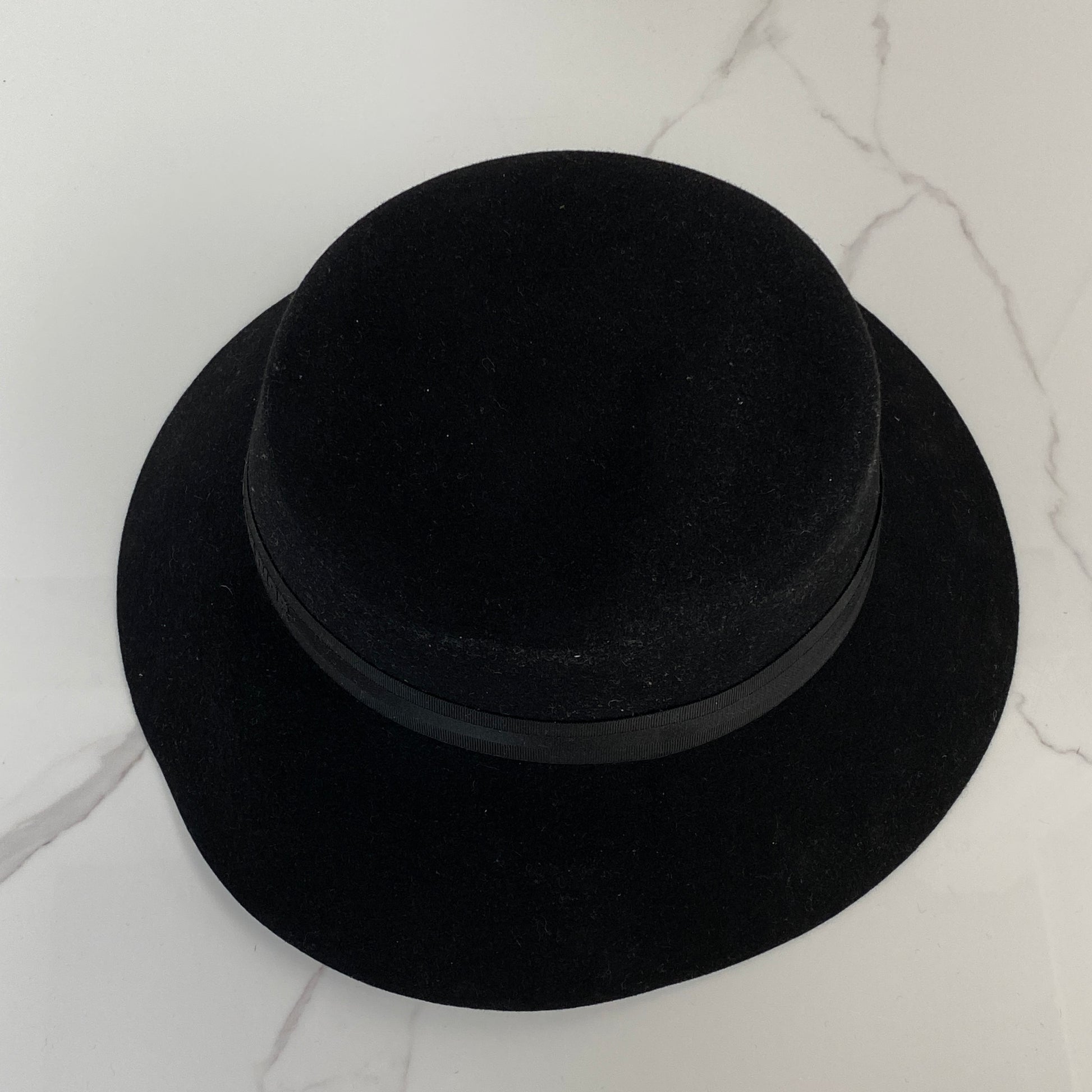 Dior D-Tulipe cloche shown with its box and paper bag