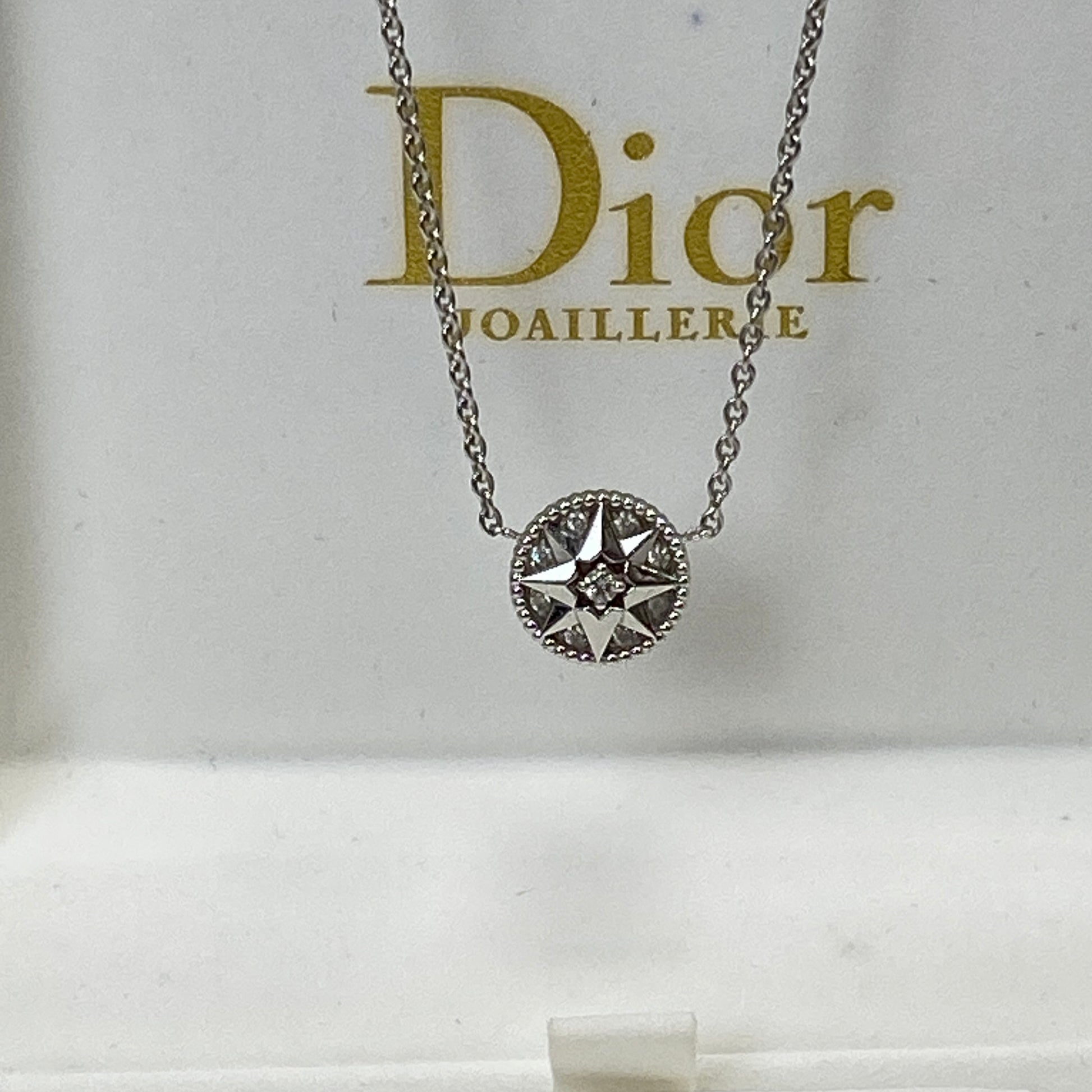 Dior Rose Des Vents necklace shown with its box and certificate
