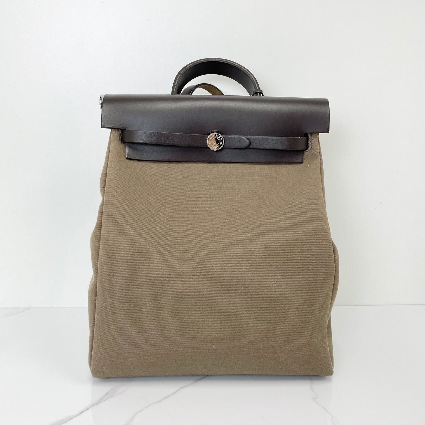 Hermès Herbag A Dos Zip Retourne Backpack in canvas with leather trim and palladium hardware