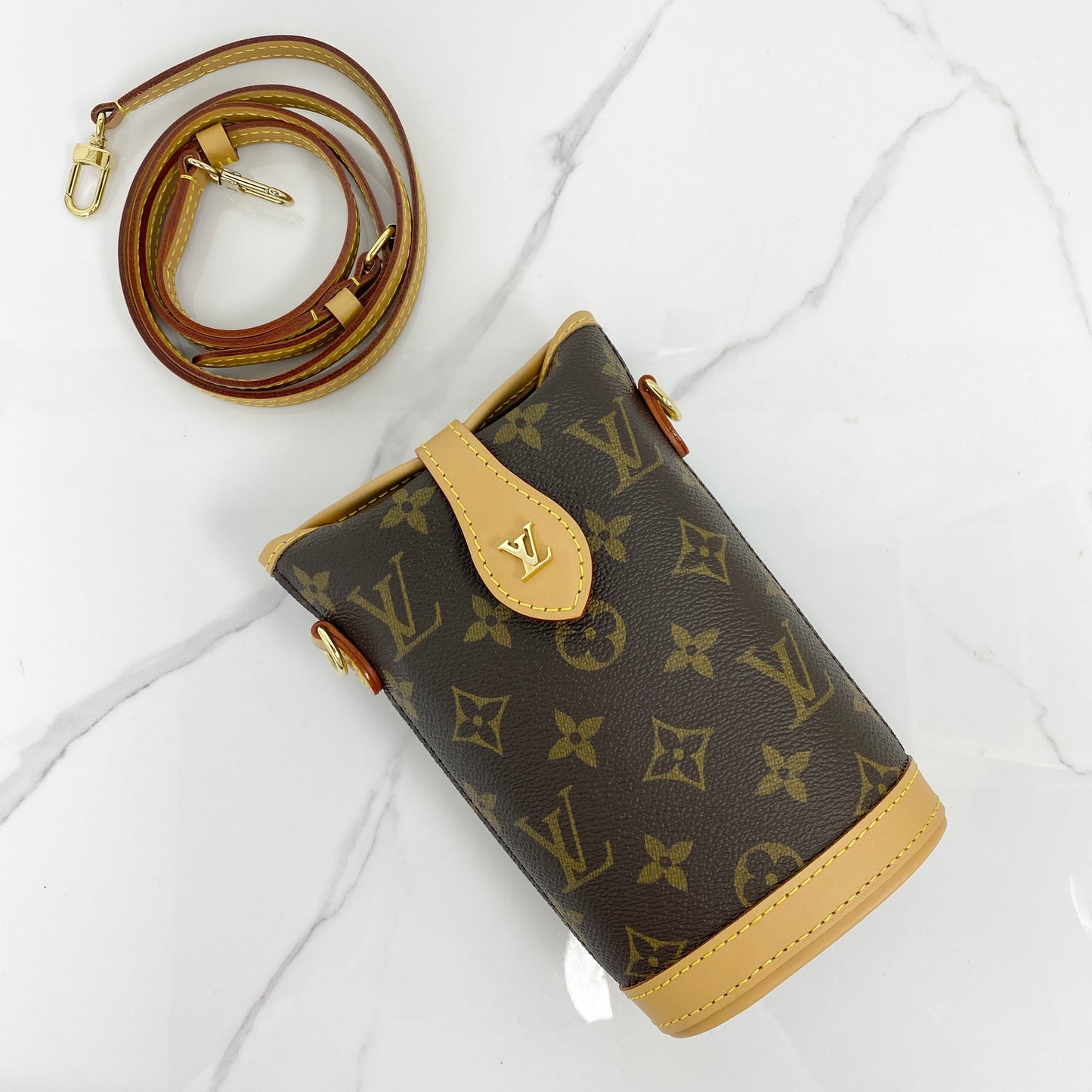 Louis Vuitton Fold Me Pouch in Monogram coated canvas with removable leather strap