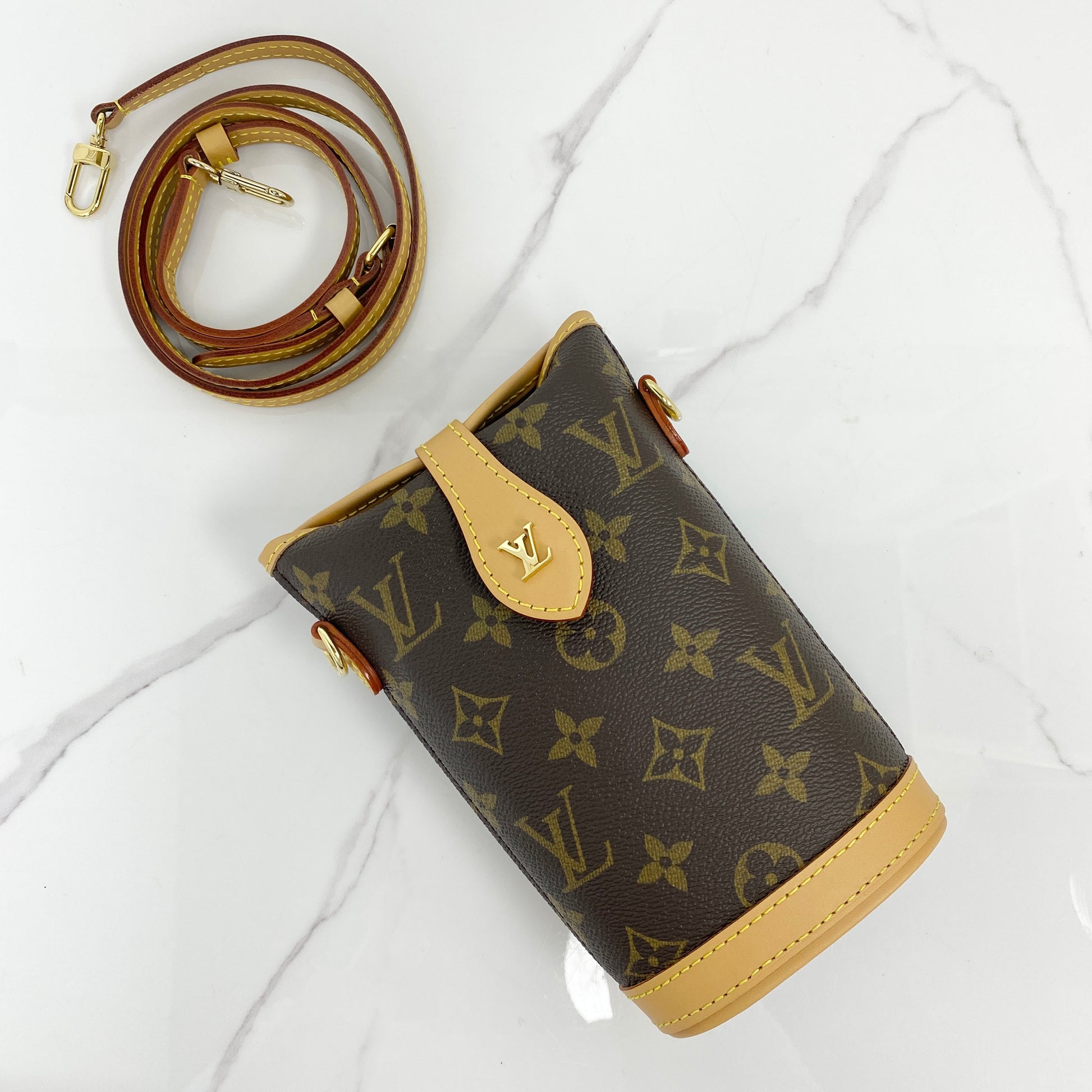 Louis Vuitton Fold Me Pouch in Monogram coated canvas with removable leather strap