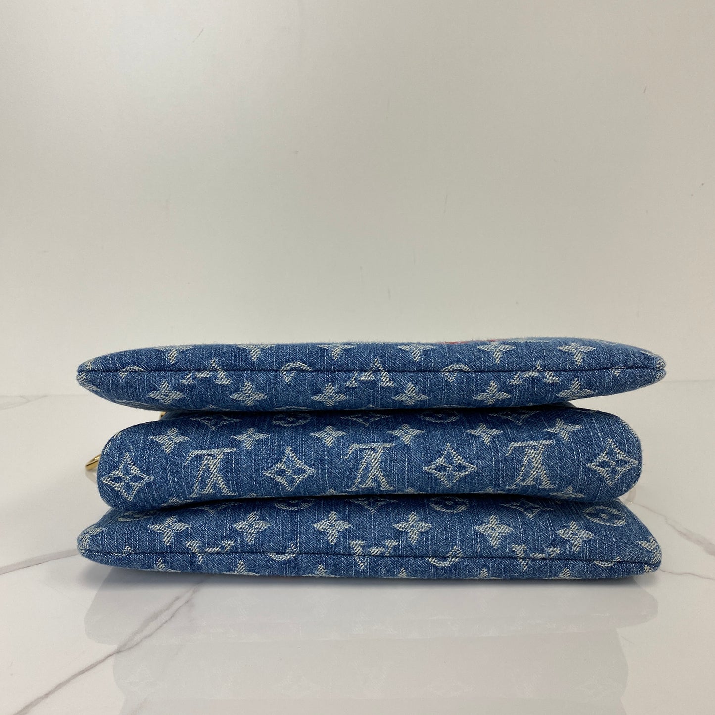 Base of the Louis Vuitton Cherry Coussin showing the quilted denim panels