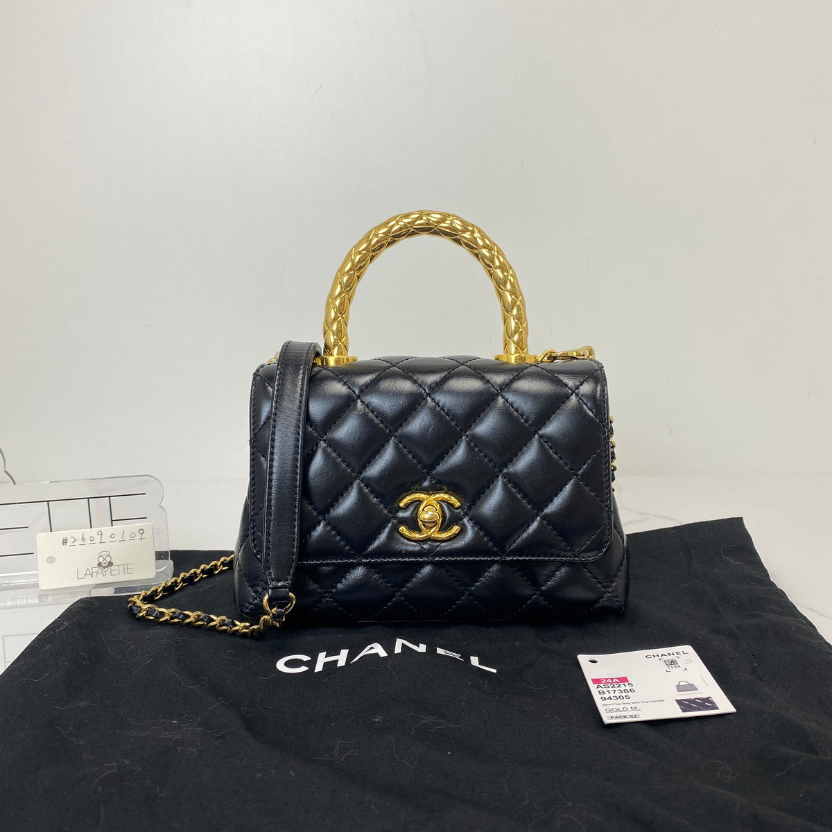 Chanel Mini Coco Handle, black shiny calfskin, gold-tone hardware — detail view 1
