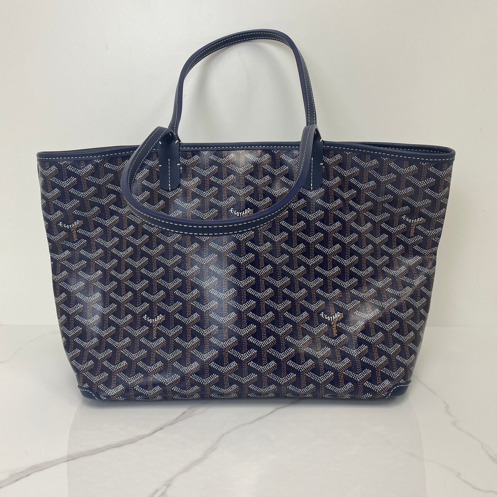 Front view of the Goyard Artois PM showing the hand-painted chevron pattern