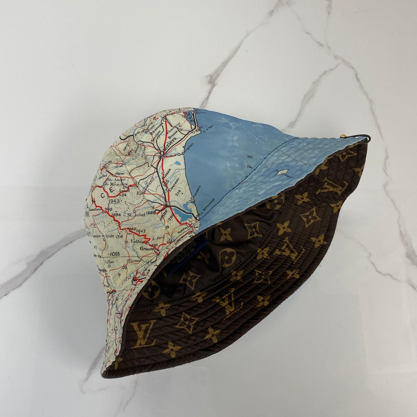 Front view of the Louis Vuitton Map Print Hat