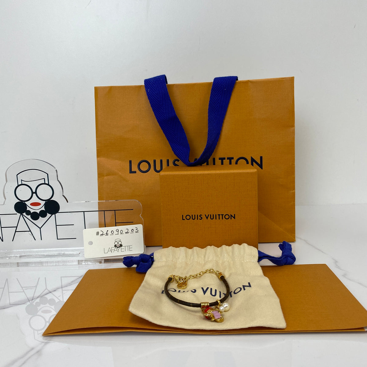 Louis Vuitton Vivienne Snow Bracelet, brown Monogram canvas, gold-tone Vivienne charm — detail view 1