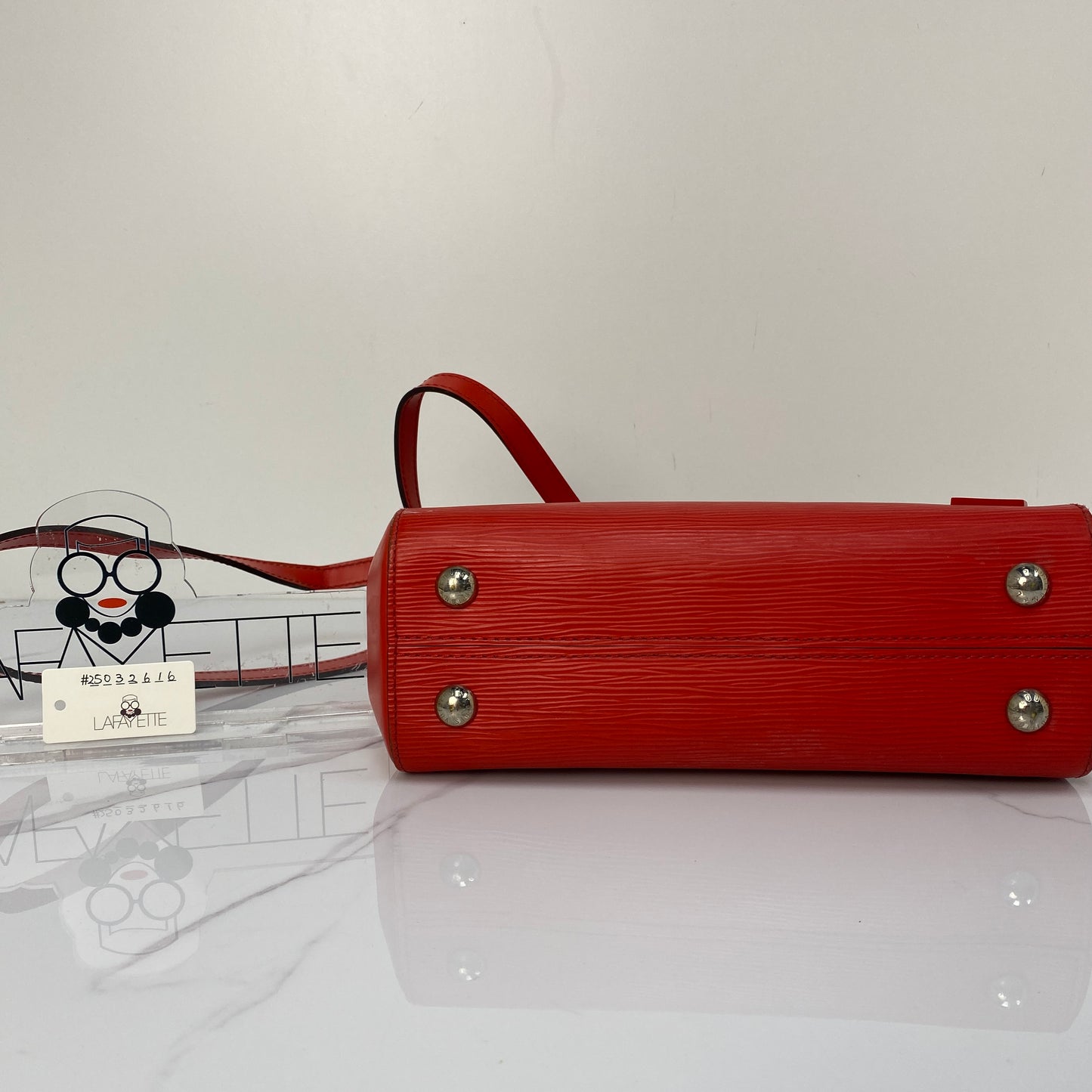 Side profile of the Louis Vuitton Epi Cluny BB