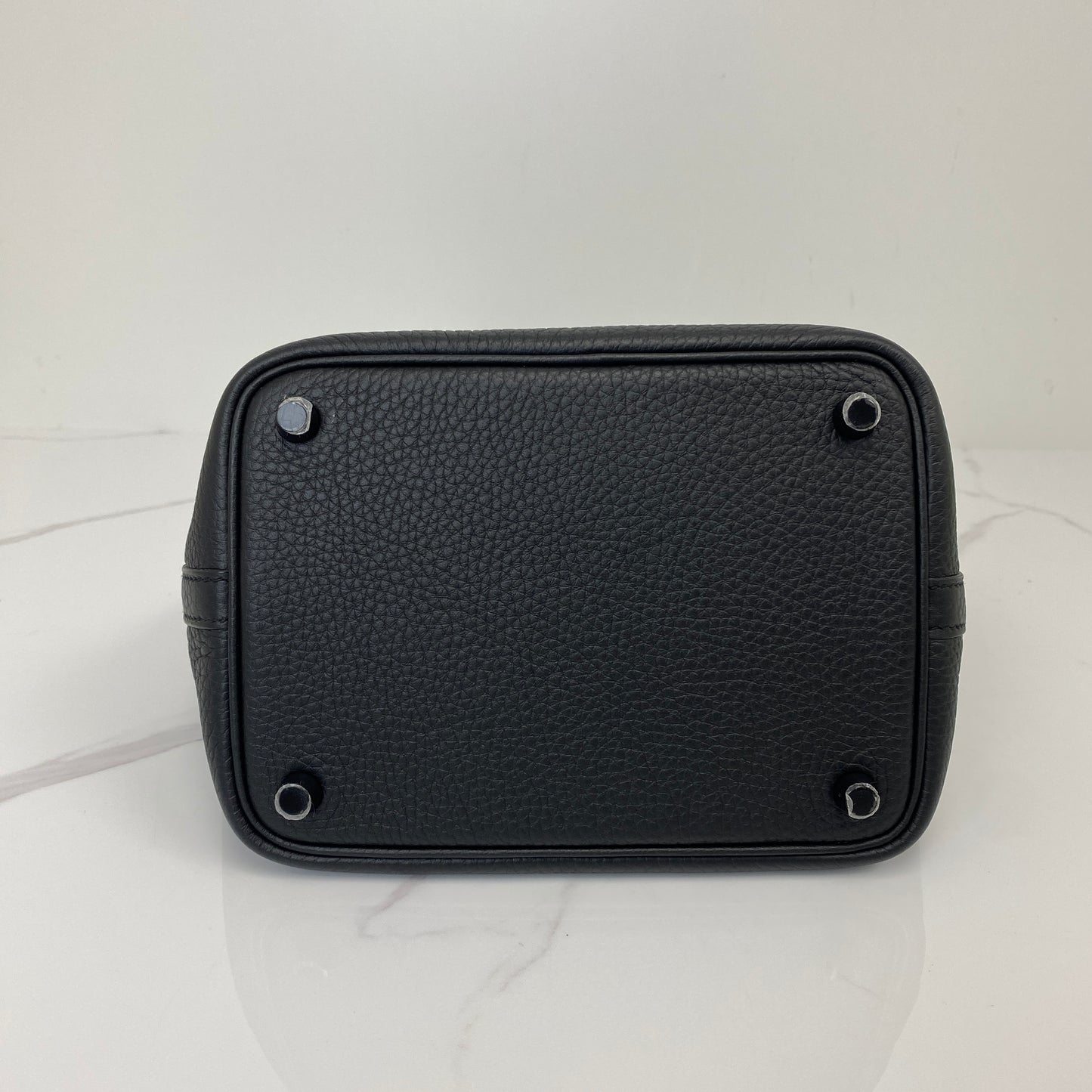 Base of the Hermès Picotin 18 with protective studs