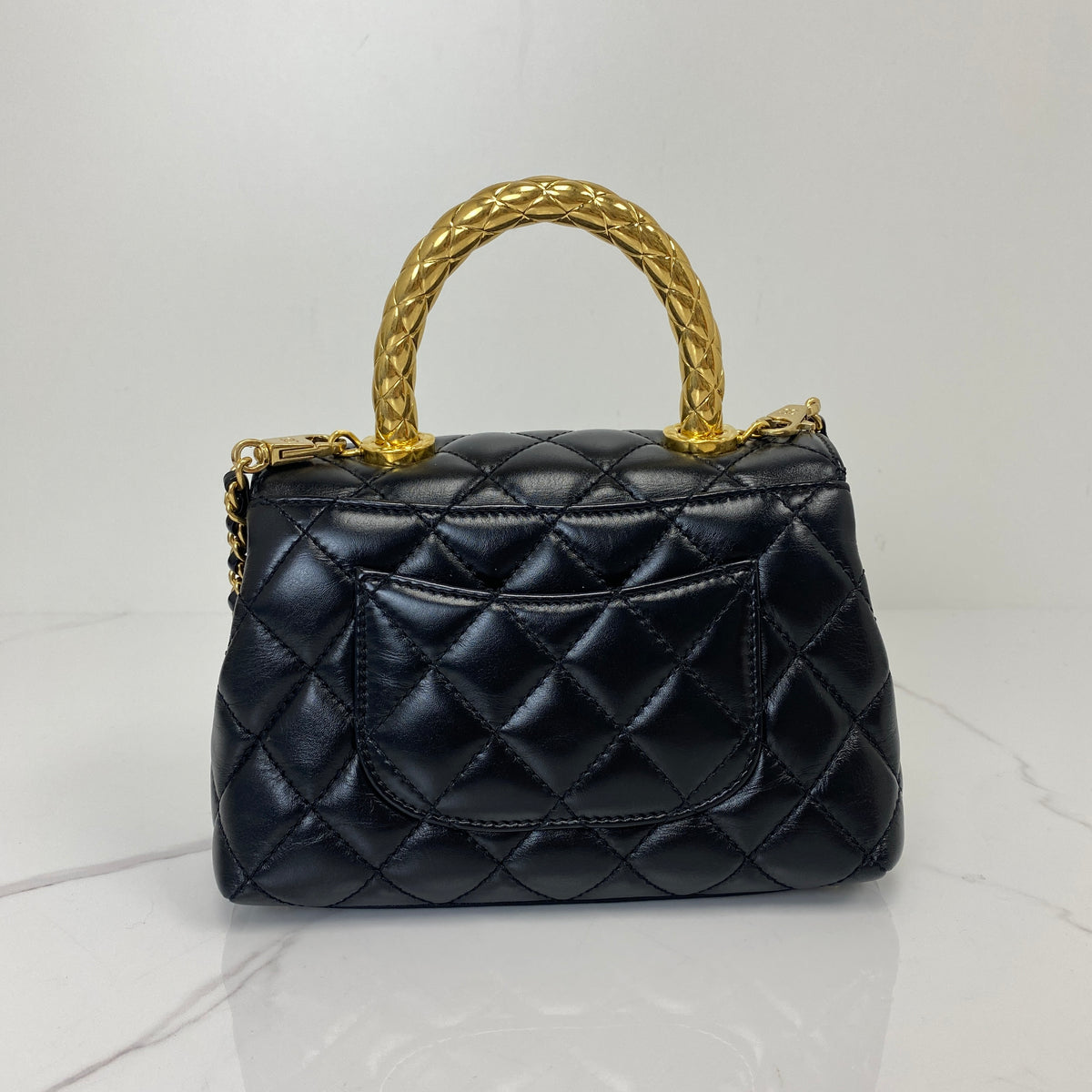Chanel Mini Coco Handle, black shiny calfskin, gold-tone hardware — detail view 3