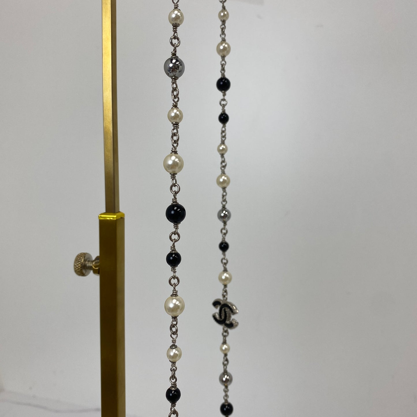 Detail of faux pearl, black and grey crystal beads on the Chanel double strand necklace