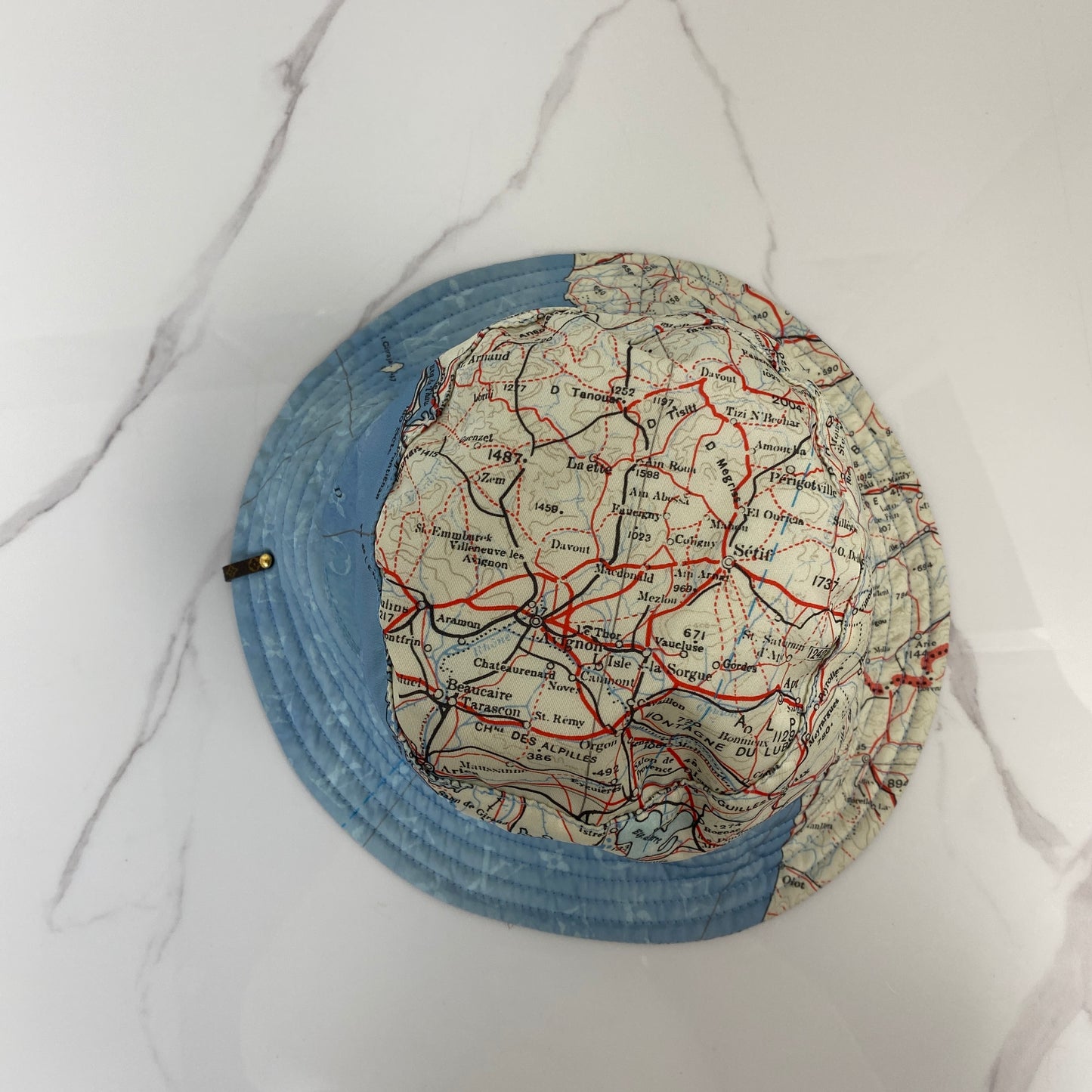 Louis Vuitton Map Print Hat shown from above
