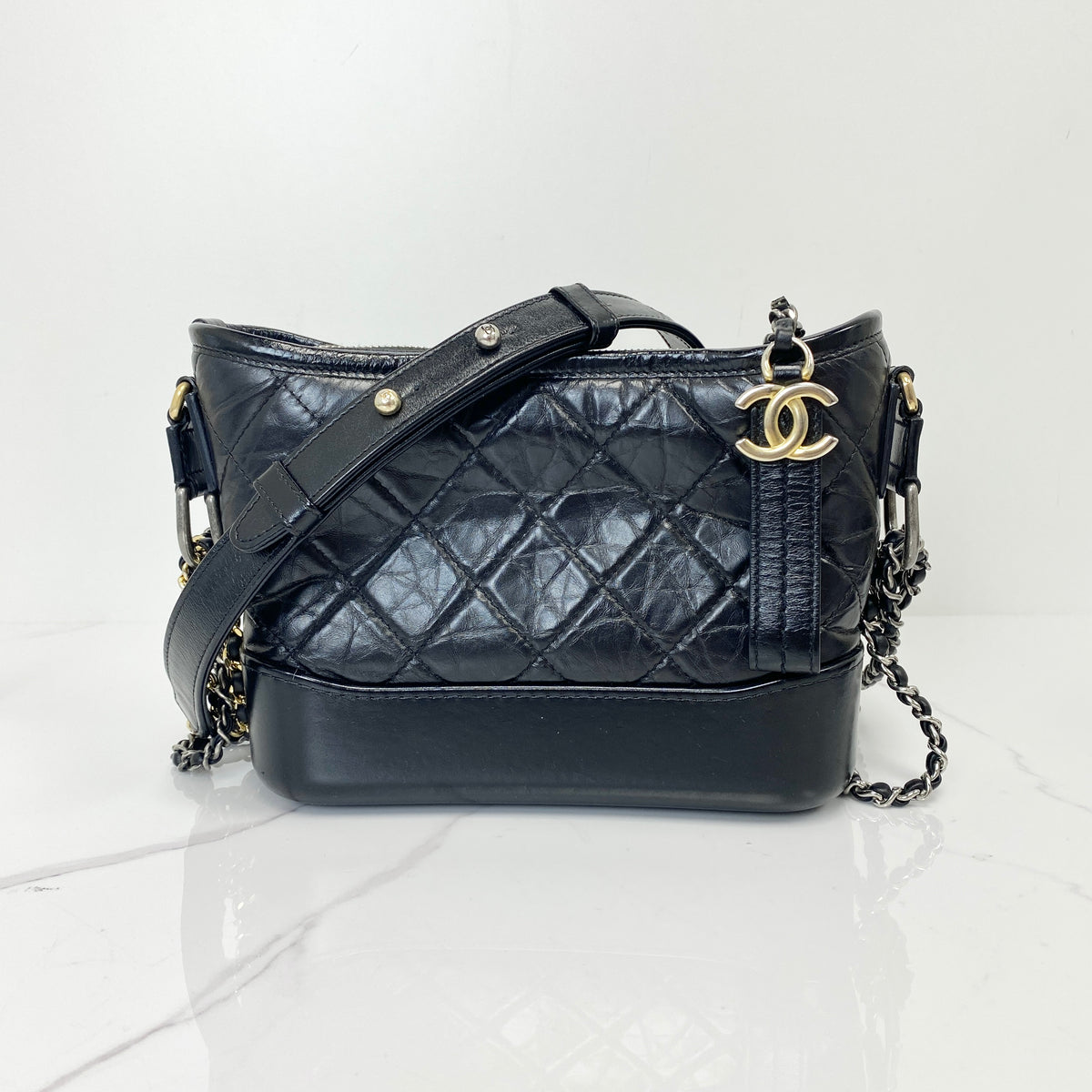 Chanel Small Gabrielle Hobo Bag Black Aged Calfskin, Black Aged Calfskin, Mixed Gold and Silver Tone — front view