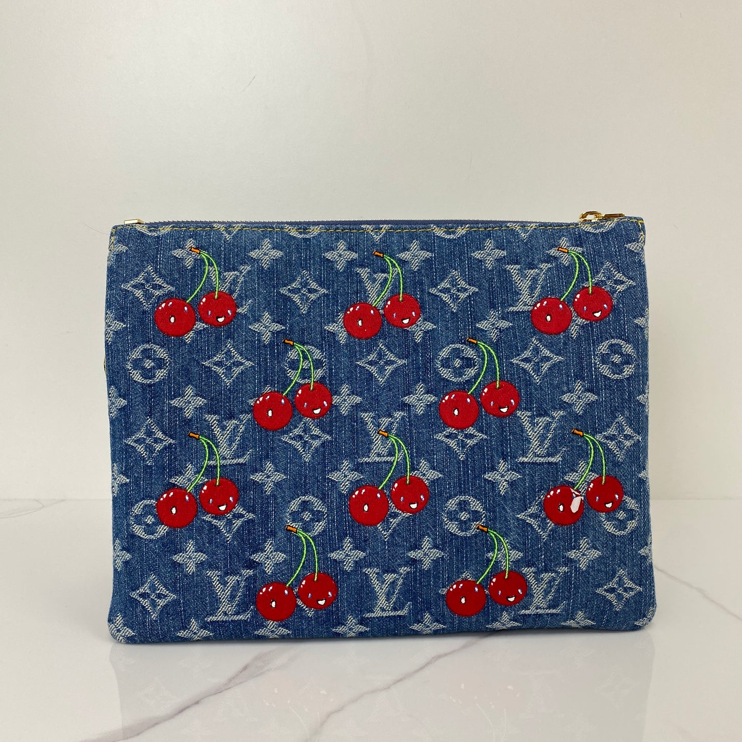 Front view of the Murakami Cherry Coussin showing the embroidered cherries