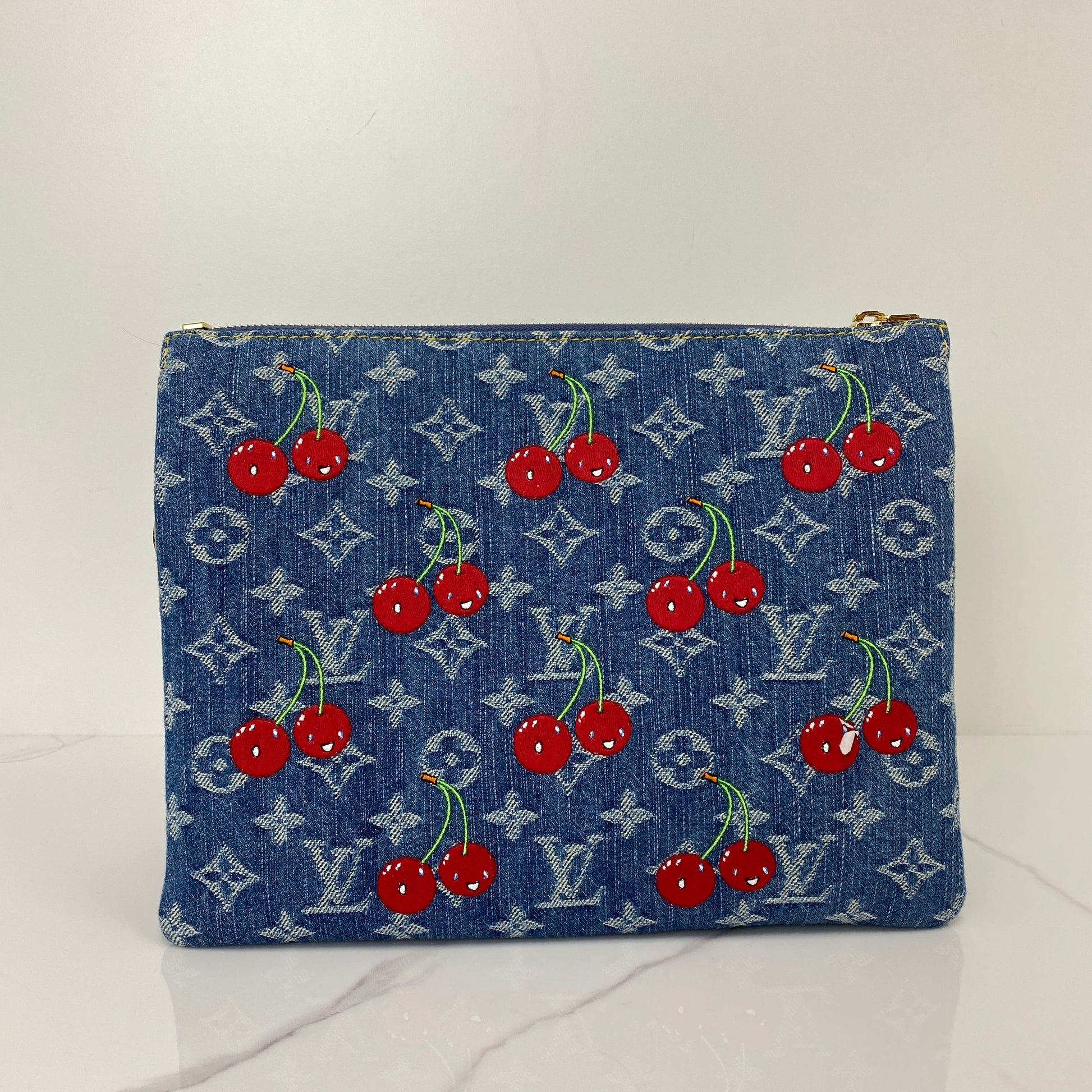 Front view of the Murakami Cherry Coussin showing the embroidered cherries