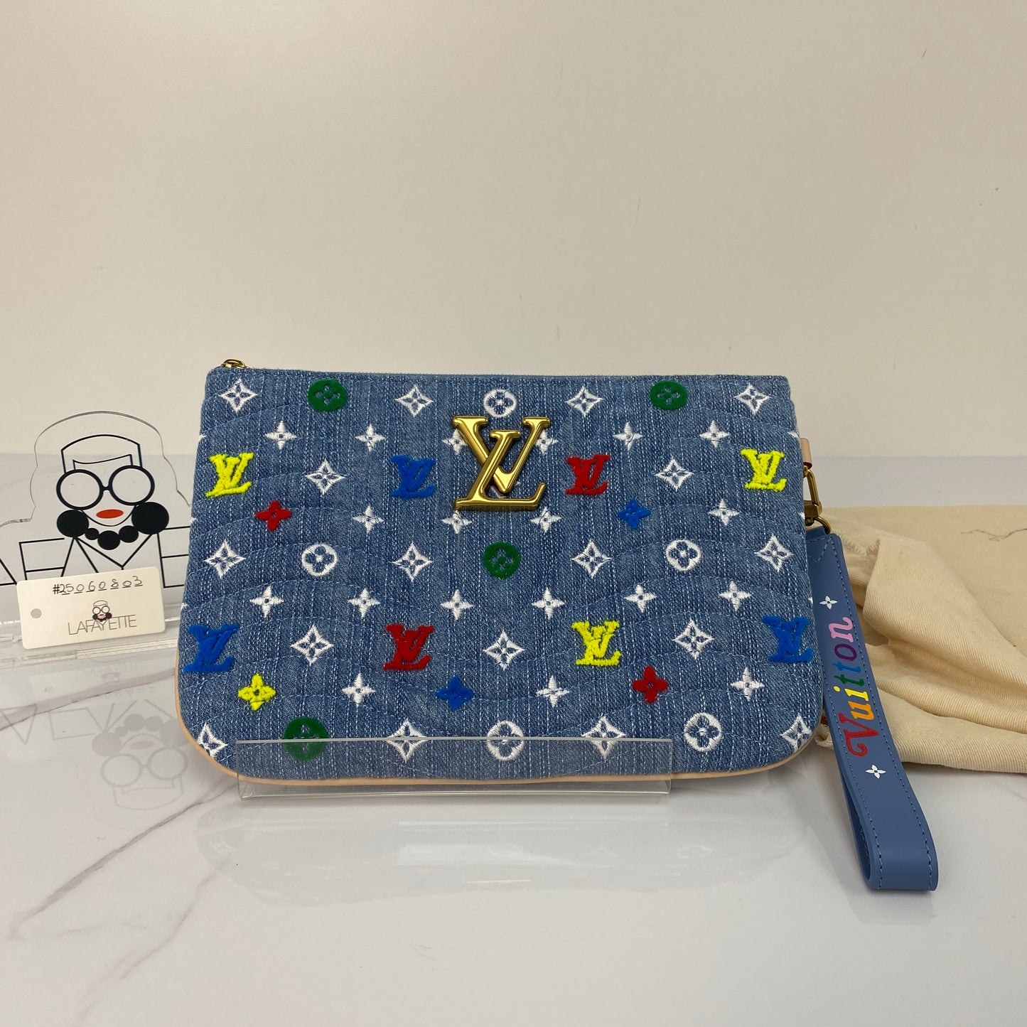 Front view of the LV Denim Monogram New Wave pouch