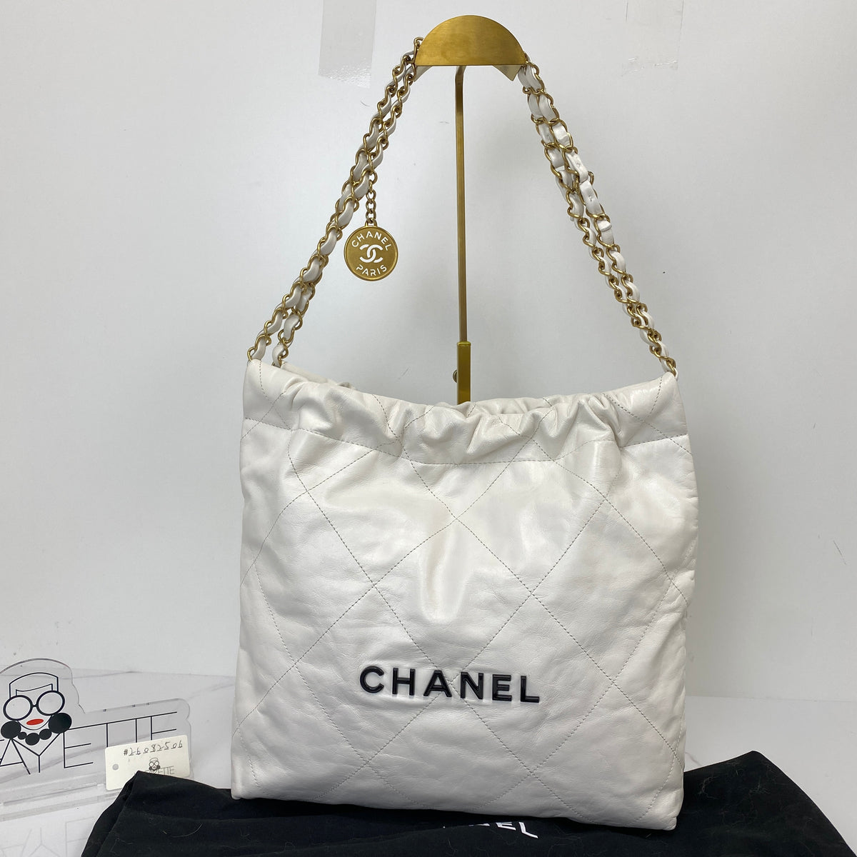 Chanel Small 22 Bag, white shiny calfskin, gold-tone chain — detail view 1