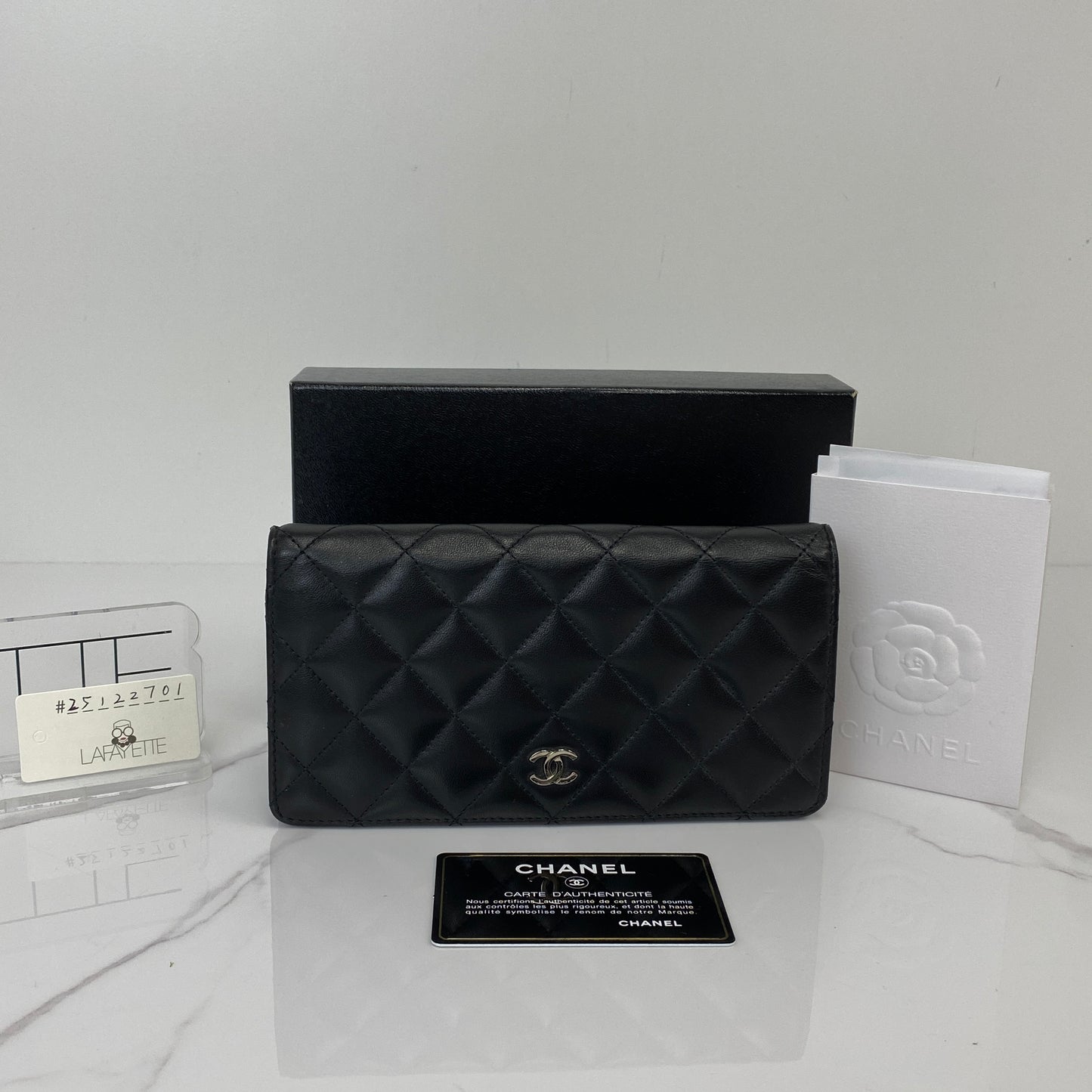 Front view of the black Chanel long flap wallet