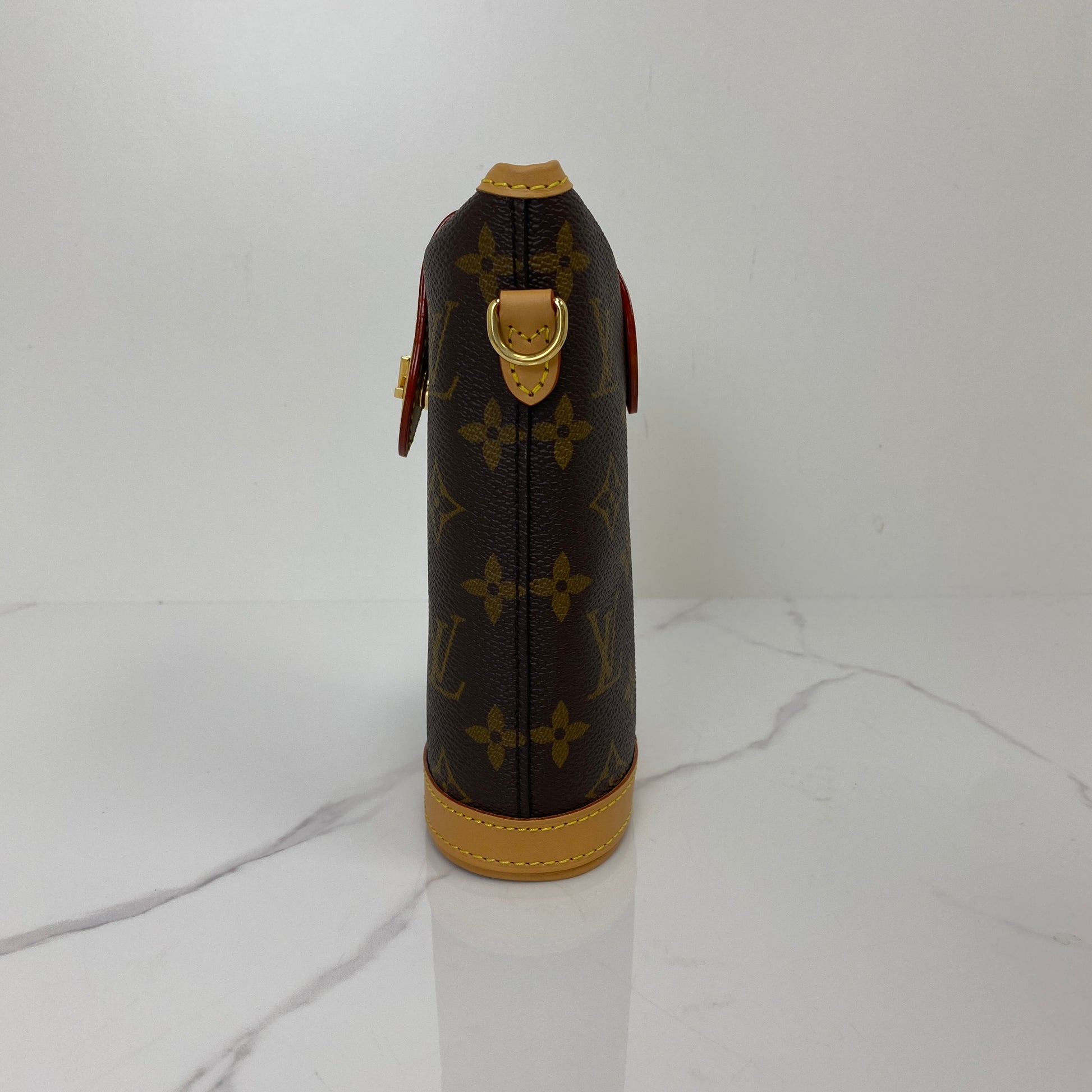 Side profile of the Louis Vuitton Fold Me Pouch