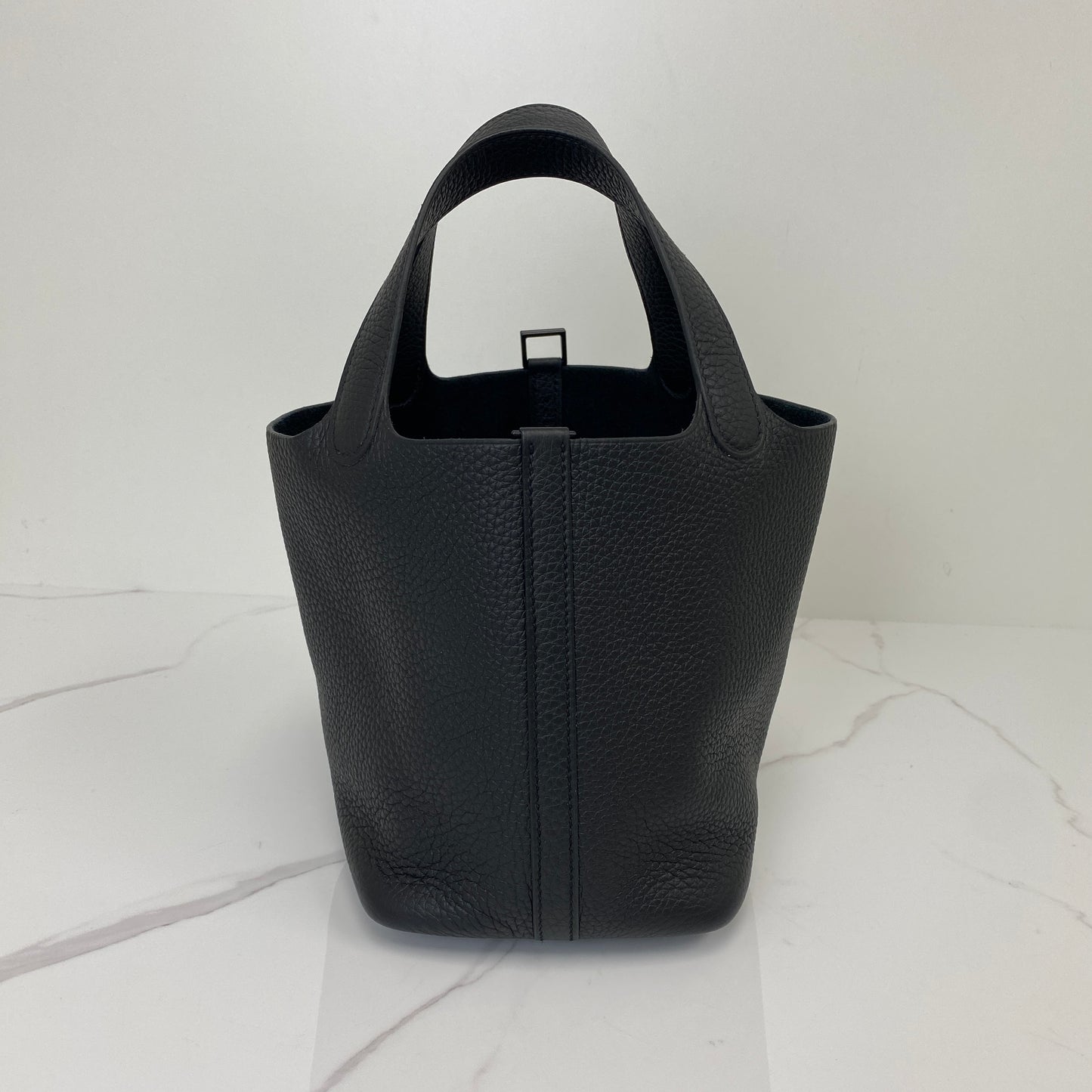 Front view of the black Hermès Picotin 18 showing the Clemence leather grain