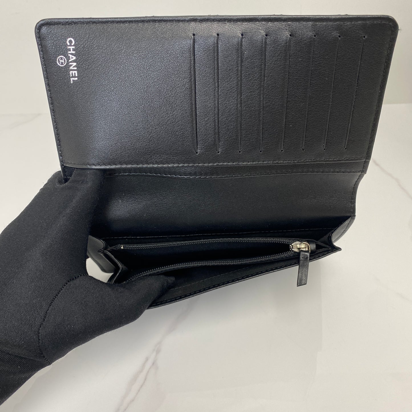 Chanel CC quilted long wallet shown with its box and dustbag