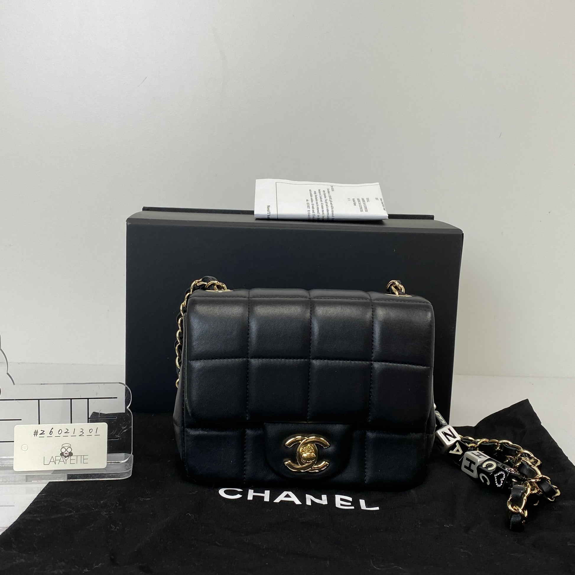 Chanel 23C mini flap shown with its box, dustbag and paperwork