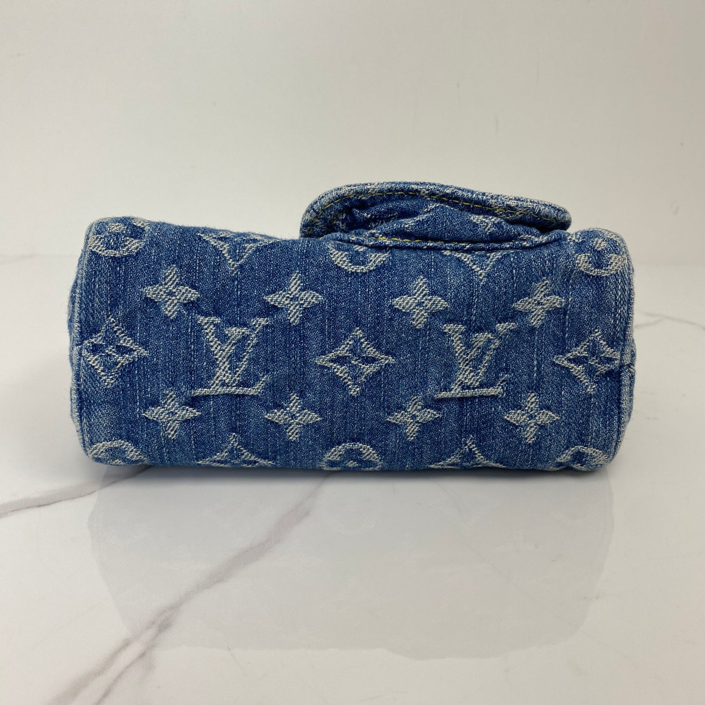 Base of the Louis Vuitton Nano Speedy showing the denim Monogram pattern