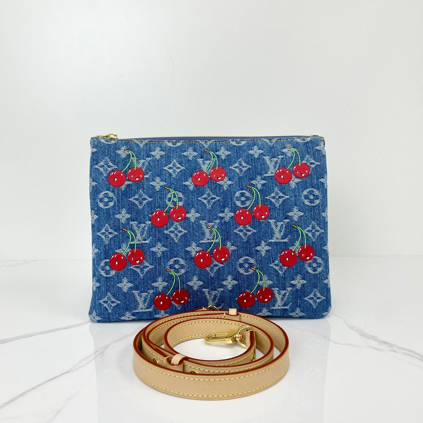 Louis Vuitton Murakami Cherry Coussin in Monogram denim with red cherry motifs and leather strap