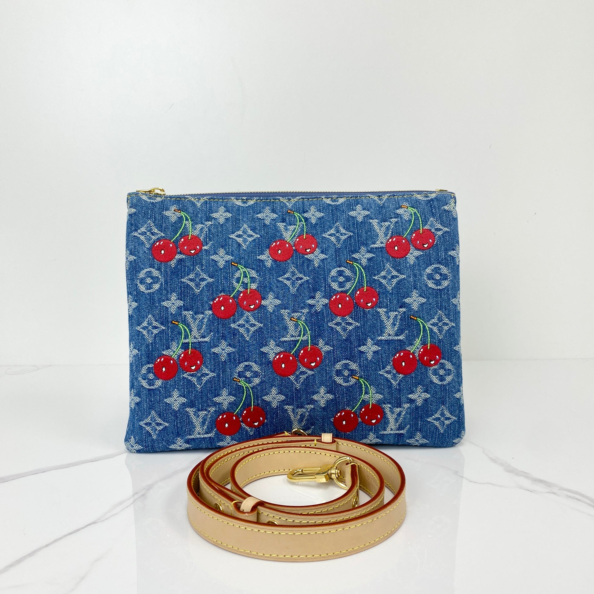 Louis Vuitton Murakami Cherry Coussin in Monogram denim with red cherry motifs and leather strap