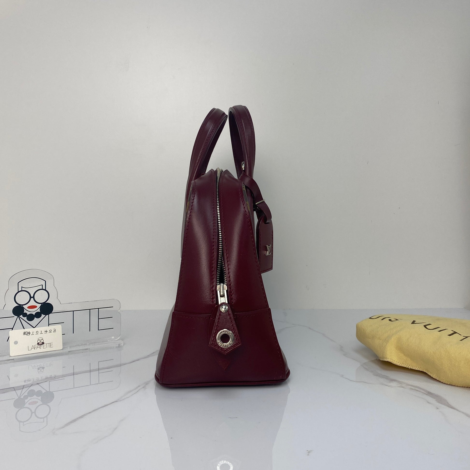 Front view of the Louis Vuitton Dora Monogram PM