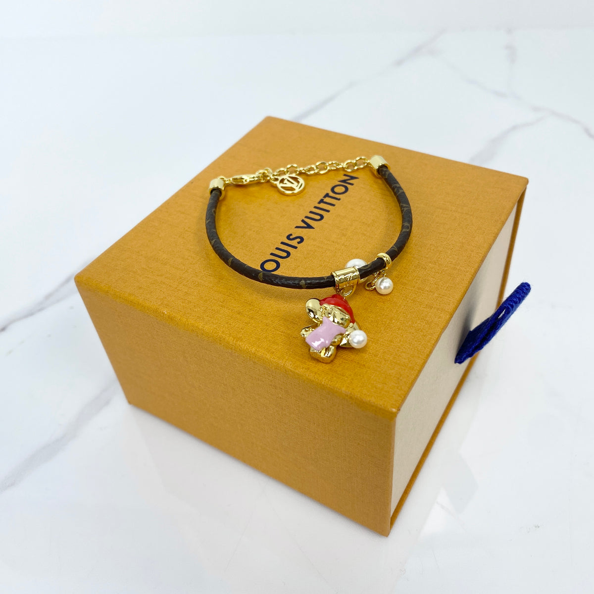 Louis Vuitton Vivienne Snow Bracelet, brown Monogram canvas, gold-tone Vivienne charm — front view