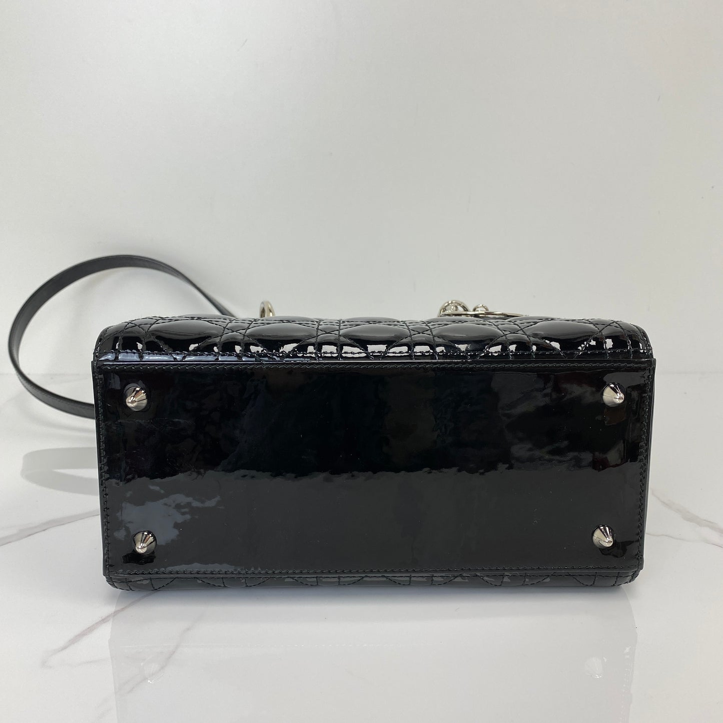 Base of the Medium Lady Dior with protective metal feet