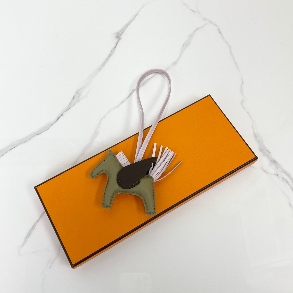 Hermès Rodeo Pegase PM bag charm in Milo lambskin and Swift calfskin