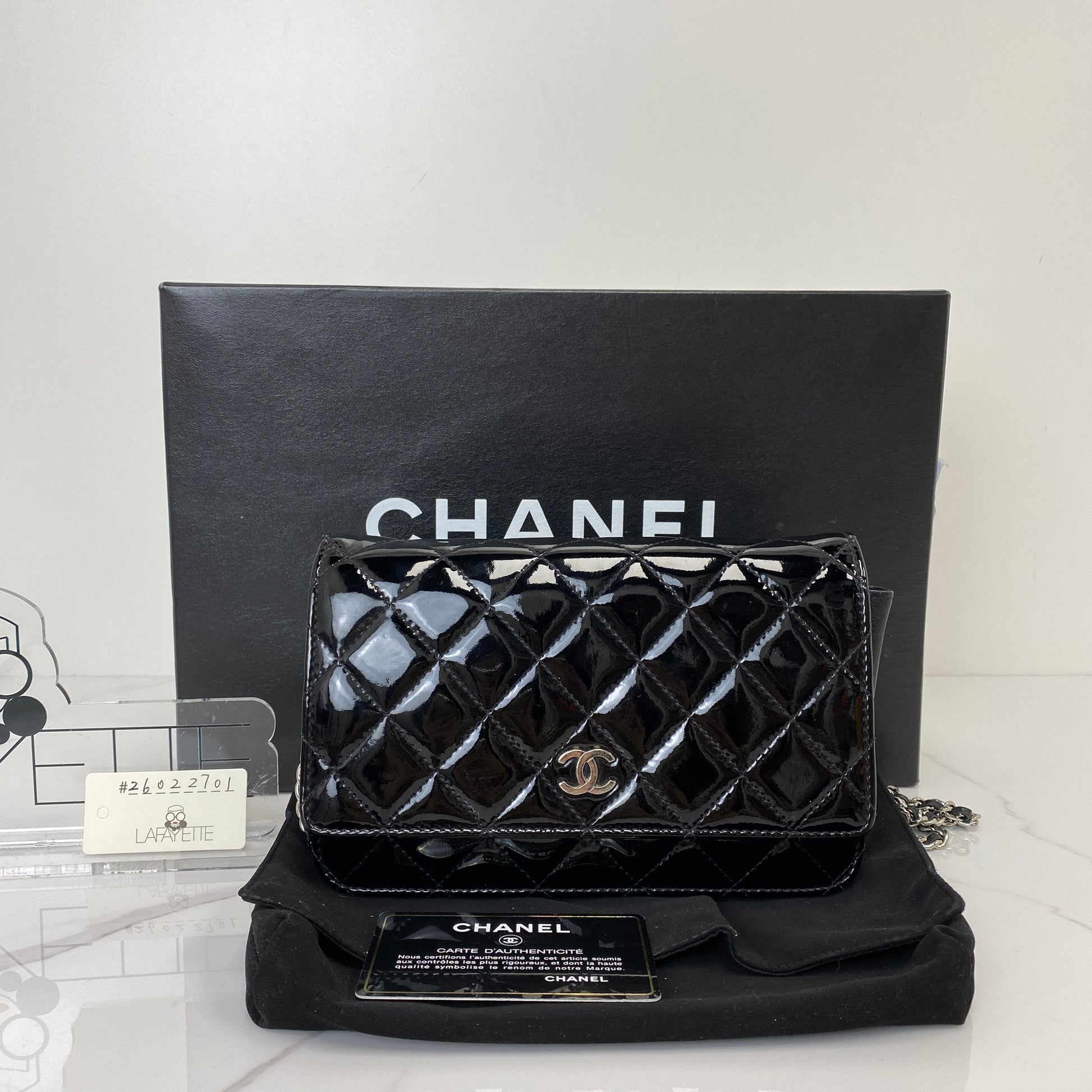 Chanel Wallet On Chain shown with its box, dustbag and authenticity card