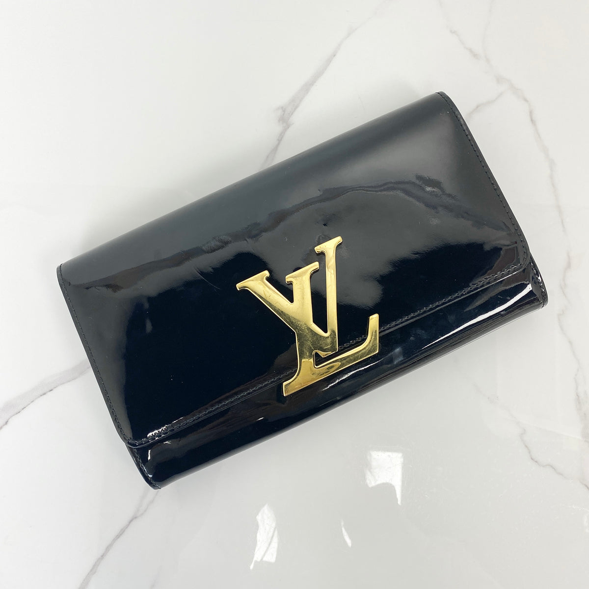 Louis Vuitton Louise Patent Leather Clutch Bag, black patent leather, gold-tone LV clasp — front view