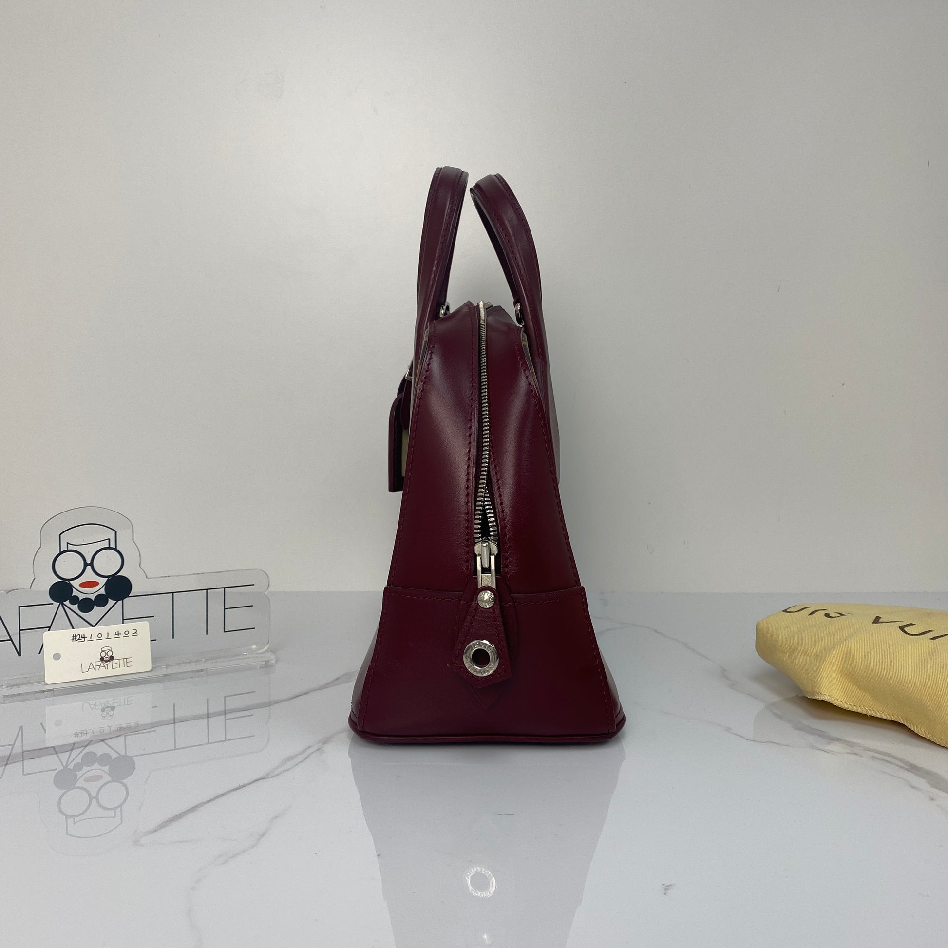 Side profile of the Louis Vuitton Dora PM in Monogram canvas