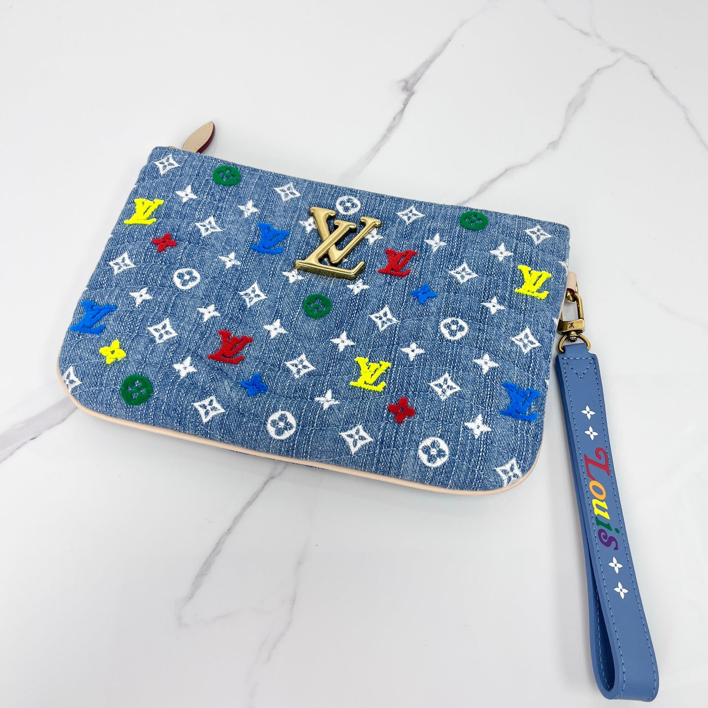 Louis Vuitton New Wave zipped pouch in denim Monogram with multicolour embroidery and wrist strap