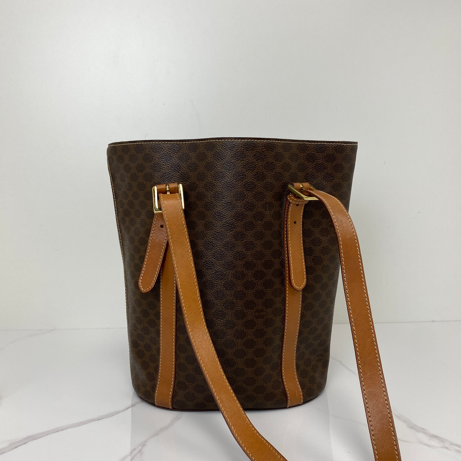 Side profile of the Celine Macadam bucket bag