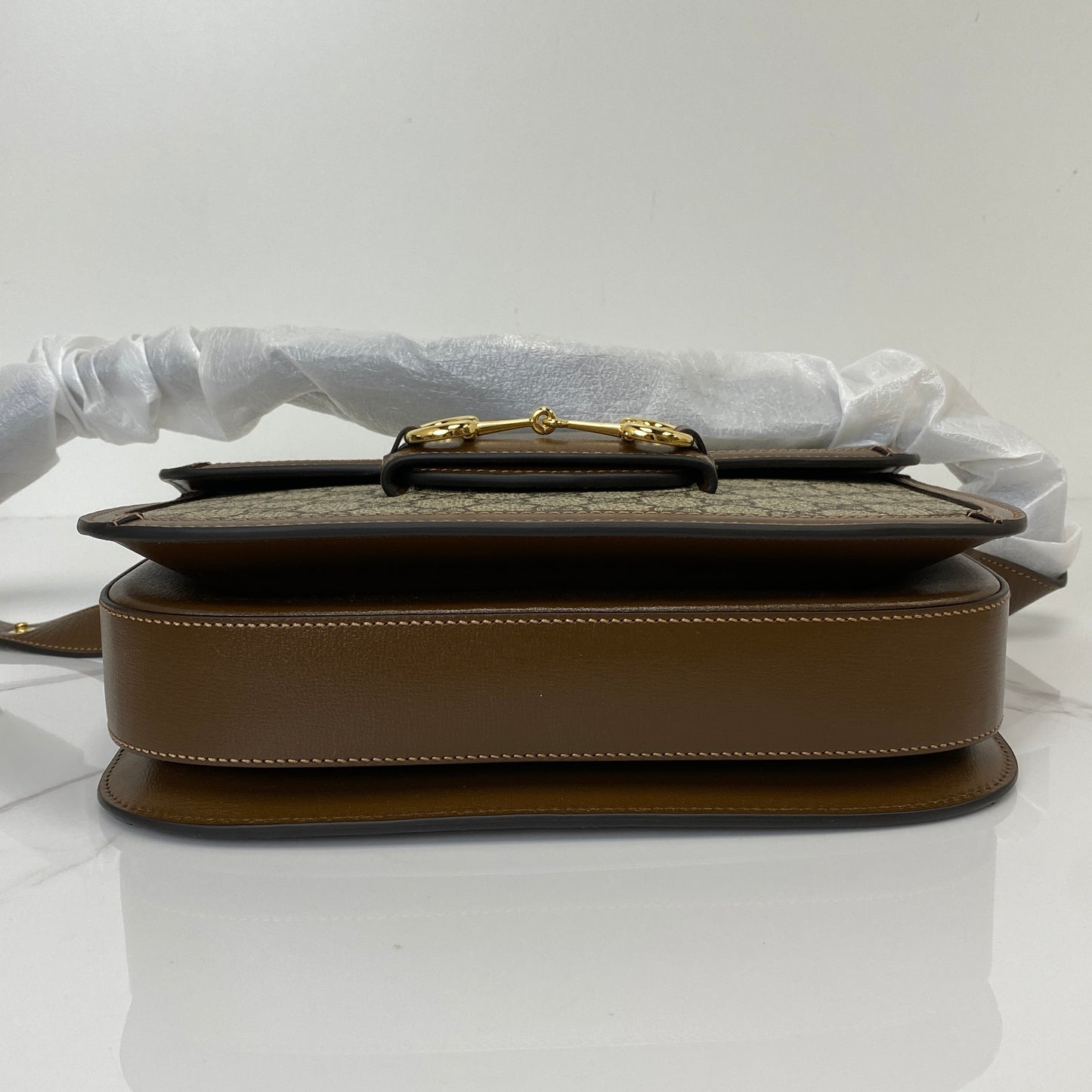 Base of the Gucci 1955 Horsebit shoulder bag in brown leather