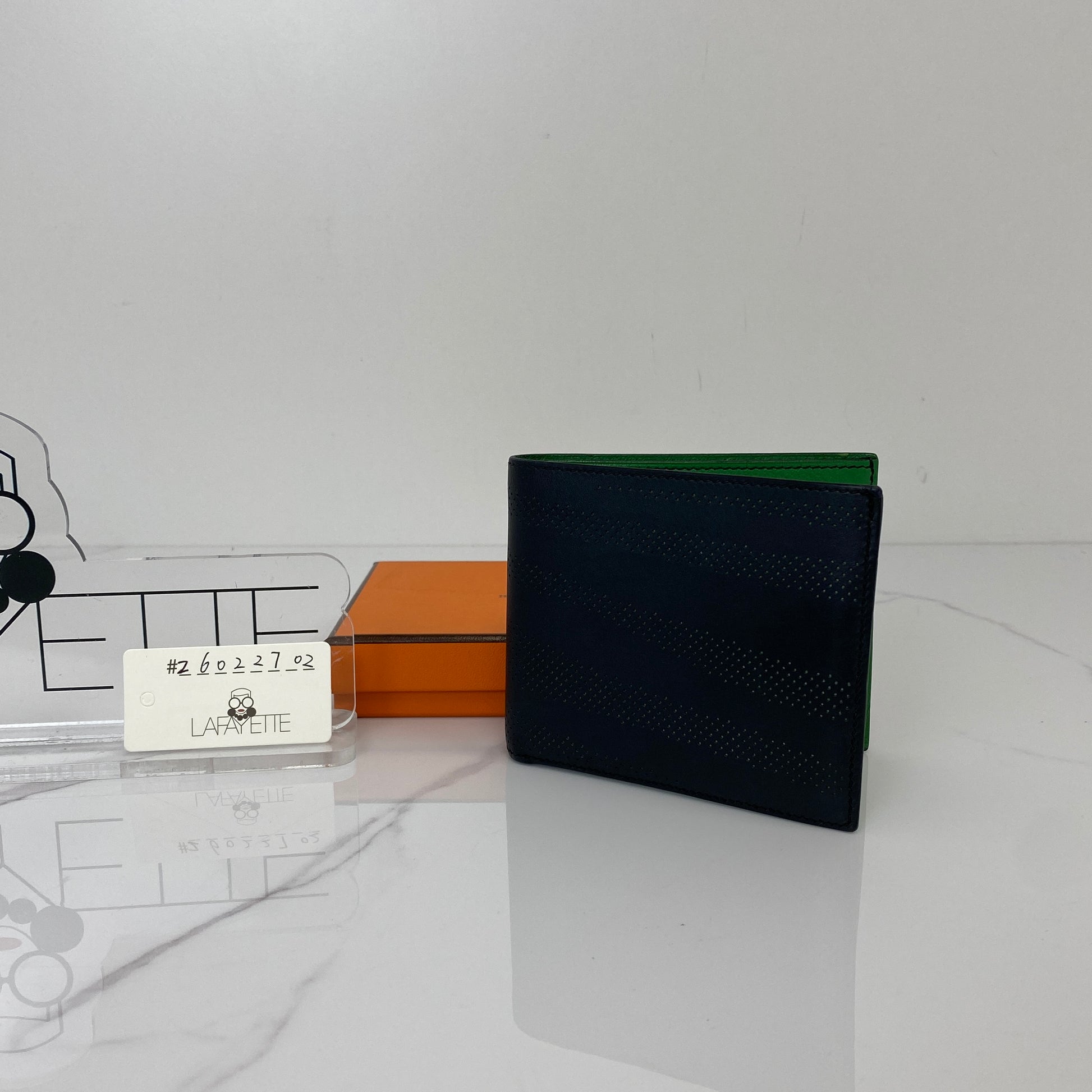 Hermès MC2 Copernic wallet shown with its orange box