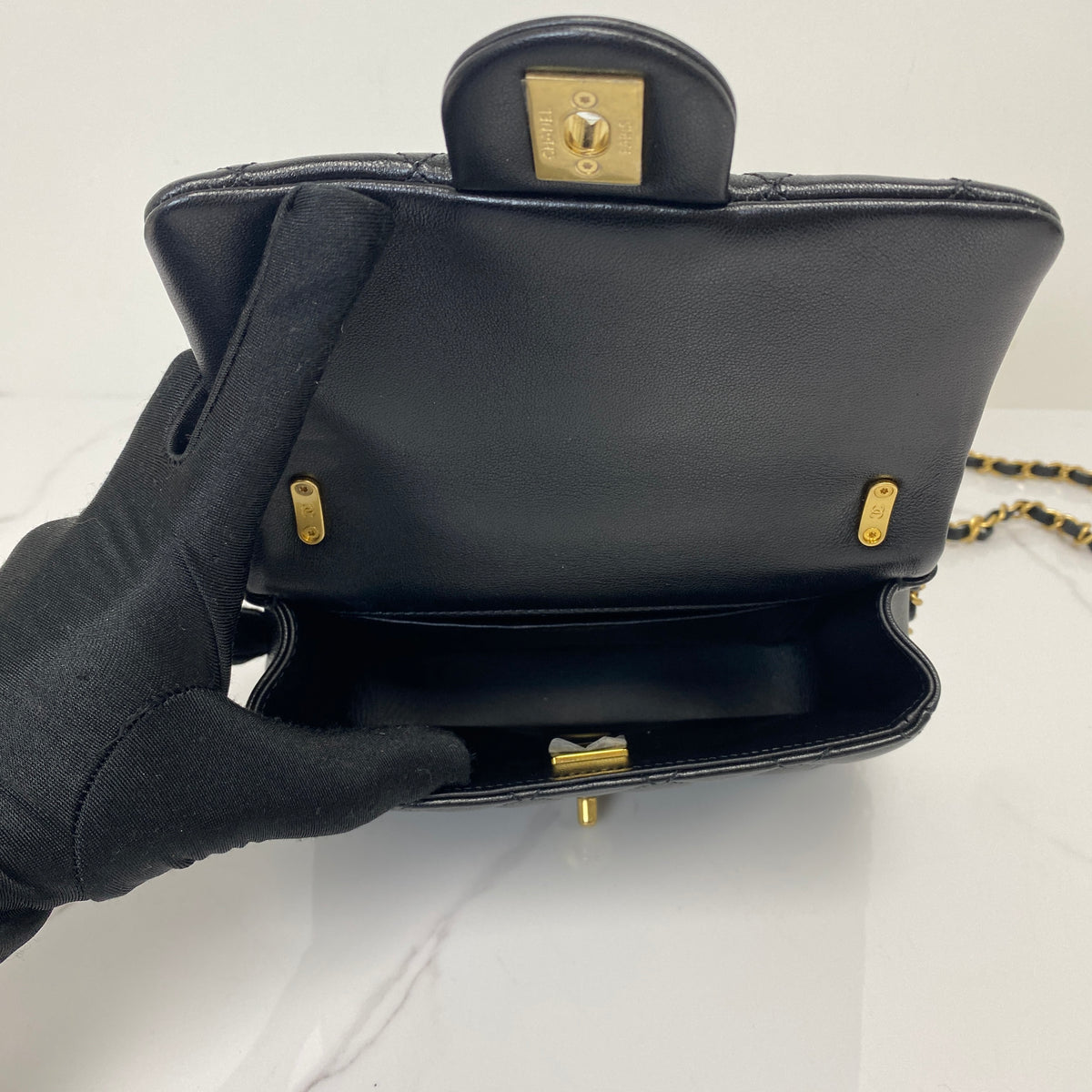 Chanel Pearl Twist Mini Classic Flap Bag, black lambskin, gold-tone hardware, pearl detail — detail view 5